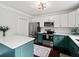 Modern kitchen with two-tone cabinets, stainless steel appliances, and bright countertops at 50 Mount Vernon Cir, Atlanta, GA 30338