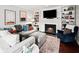 Cozy living room with fireplace, built-in bookshelves, and comfortable seating at 50 Mount Vernon Cir, Atlanta, GA 30338