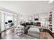 Comfortable living space with large sectional, bay window, and built-in shelving at 50 Mount Vernon Cir, Atlanta, GA 30338