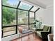 Sunroom with floor-to-ceiling windows that provide views of the backyard at 50 Mount Vernon Cir, Atlanta, GA 30338