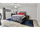 Spacious bedroom features a queen bed, grey decor, and mirrored wall providing ample space at 830 Bonnie Glen Se Dr, Marietta, GA 30067