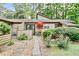 Inviting exterior showcasing the home's patio, lush landscaping, and well-maintained surroundings at 830 Bonnie Glen Se Dr, Marietta, GA 30067