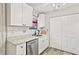 Bright kitchen with white cabinetry, stainless steel dishwasher and granite countertops at 830 Bonnie Glen Se Dr, Marietta, GA 30067