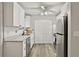 Modern kitchen featuring white cabinets, stainless steel appliances, and sleek countertops at 830 Bonnie Glen Se Dr, Marietta, GA 30067