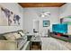 Inviting living room featuring a blue world map decor, a ceiling fan, and comfortable seating at 830 Bonnie Glen Se Dr, Marietta, GA 30067