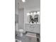 Bright bathroom with dual sinks, elegant mirrors, and modern vanity at 230 Sheringham Dr, Roswell, GA 30076