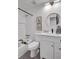 Stylish bathroom featuring a shower-tub combo, and a round vanity mirror at 230 Sheringham Dr, Roswell, GA 30076
