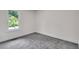 Clean bedroom with neutral carpeting, a large window providing natural light at 230 Sheringham Dr, Roswell, GA 30076