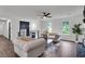 Bright living area with comfortable seating, a fireplace, and large windows, offering a welcoming space for relaxation and entertainment at 230 Sheringham Dr, Roswell, GA 30076