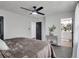 Spacious main bedroom featuring plush carpeting, and a view of the ensuite bathroom at 230 Sheringham Dr, Roswell, GA 30076