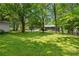 Large backyard with mature trees at 2661 Fleur De Lis Pl, Atlanta, GA 30360