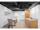 Finished basement offering a bright and versatile living space with a convenient wet bar at 2661 Fleur De Lis Pl, Atlanta, GA 30360