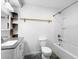 Bathroom with granite vanity, mirror, modern lighting, a toilet, and a tub with shower at 2661 Fleur De Lis Pl, Atlanta, GA 30360