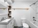 Bathroom with granite vanity, mirror, modern lighting, a toilet, and a tub with shower at 2661 Fleur De Lis Pl, Atlanta, GA 30360