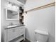 Bathroom with modern vanity, granite counters, modern lighting, mirror, and a toilet at 2661 Fleur De Lis Pl, Atlanta, GA 30360