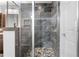 Beautiful glass shower stall with a mosaic tile floor, and a built-in bench at 2661 Fleur De Lis Pl, Atlanta, GA 30360