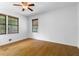 Bedroom with hardwood floors, neutral walls, and two windows at 2661 Fleur De Lis Pl, Atlanta, GA 30360