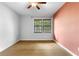 Bedroom with light hardwood floors, neutral walls and ceiling fan at 2661 Fleur De Lis Pl, Atlanta, GA 30360