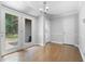 Dining area with wood floors, natural light from a double door opening to the outdoors and white trim at 2661 Fleur De Lis Pl, Atlanta, GA 30360