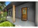 Close-up of home's front entry with a wooden door and decorative glass at 2661 Fleur De Lis Pl, Atlanta, GA 30360