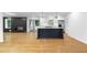 Open concept kitchen with island, stainless steel appliances, and a fireplace at 2661 Fleur De Lis Pl, Atlanta, GA 30360