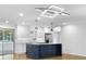 Kitchen island with white countertop, dark blue base cabinets, and stainless steel appliances at 2661 Fleur De Lis Pl, Atlanta, GA 30360
