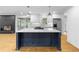Kitchen island featuring a white countertop, dark blue cabinets and pendant lighting at 2661 Fleur De Lis Pl, Atlanta, GA 30360