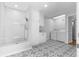 Spacious laundry room with a tiled shower, white cabinets, washer, and dryer hookups at 2661 Fleur De Lis Pl, Atlanta, GA 30360