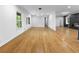 Bright living room with hardwood floors, modern lighting, and ample natural light at 2661 Fleur De Lis Pl, Atlanta, GA 30360