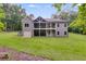 The back exterior offers a screened-in porch and garage at 7269 Tyree Rd, Winston, GA 30187