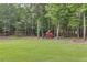 Large backyard includes a swing set at 7269 Tyree Rd, Winston, GA 30187