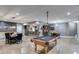 Open basement featuring a pool table, dining area, and wet bar, perfect for entertaining at 7269 Tyree Rd, Winston, GA 30187