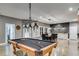 Basement featuring a pool table, dining area, and bar with outdoor access at 7269 Tyree Rd, Winston, GA 30187