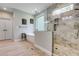 Bathroom featuring a large soaking tub and glass shower at 7269 Tyree Rd, Winston, GA 30187