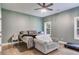 Comfortable bedroom with a neutral color palette, ceiling fan, and lots of natural light at 7269 Tyree Rd, Winston, GA 30187