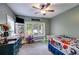 Comfortable bedroom with ceiling fan, natural light, and playful decor at 7269 Tyree Rd, Winston, GA 30187