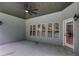Covered patio featuring a ceiling fan and neutral paint, perfect for outdoor entertaining and relaxation at 7269 Tyree Rd, Winston, GA 30187