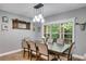 Dining room with hardwood floors and a large window offering views of the backyard at 7269 Tyree Rd, Winston, GA 30187