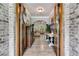 Elegant entryway featuring hardwood floors, wainscoting, and a glimpse of the living room at 7269 Tyree Rd, Winston, GA 30187