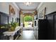 Inviting foyer with hardwood floors, custom trim, and a view of the landscaped front yard at 7269 Tyree Rd, Winston, GA 30187