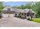Charming one-story home featuring a two-car garage, covered porch, and well-manicured landscaping at 7269 Tyree Rd, Winston, GA 30187