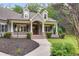 Inviting front exterior featuring a brick facade and covered porch at 7269 Tyree Rd, Winston, GA 30187