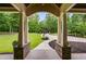 View from the front porch showcasing a well-manicured lawn and circular driveway at 7269 Tyree Rd, Winston, GA 30187