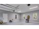 Spacious three car garage with well-lit area, ample storage, and work space at 7269 Tyree Rd, Winston, GA 30187