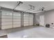 Clean and spacious garage with three car capacity and natural light from windows at 7269 Tyree Rd, Winston, GA 30187