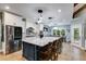 Eat-in kitchen island with stone countertops and stainless appliances, perfect for casual dining at 7269 Tyree Rd, Winston, GA 30187