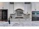 Kitchen with stone countertops, a large sink, and stainless steel appliances at 7269 Tyree Rd, Winston, GA 30187