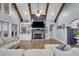 Bright living room featuring wood floors, a fireplace, and a vaulted ceiling with wood beams at 7269 Tyree Rd, Winston, GA 30187