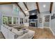 Spacious living room featuring a fireplace, built-in shelving, and large windows at 7269 Tyree Rd, Winston, GA 30187