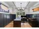 Sophisticated office with custom woodwork, hardwood floors, and elegant chandelier at 7269 Tyree Rd, Winston, GA 30187